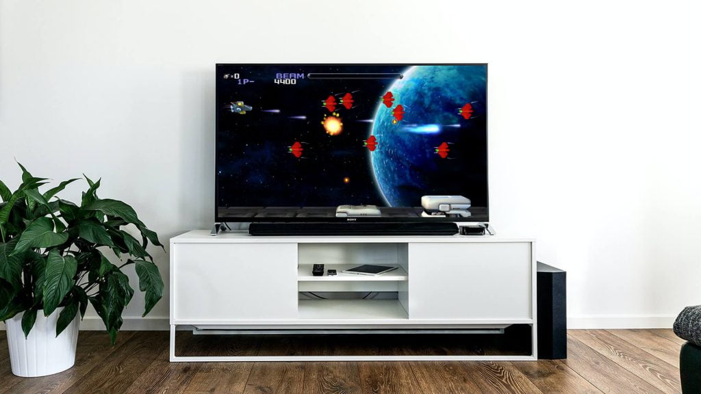 R Type game in modern flat screen TV in living room image. Image of R Type game in modern flat screen TV in living room.